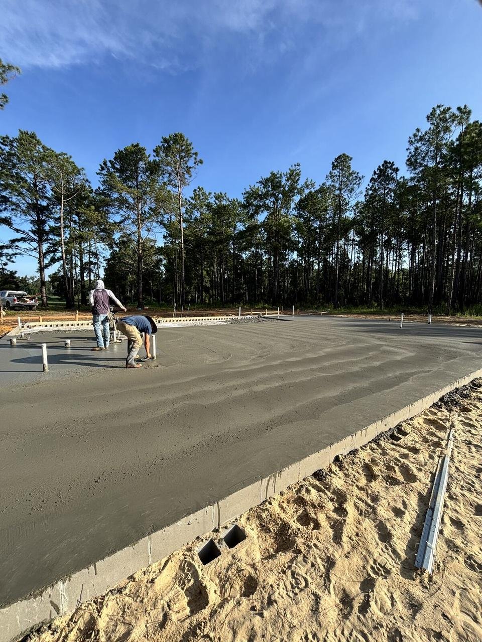 Crew finishing a large foundation slab